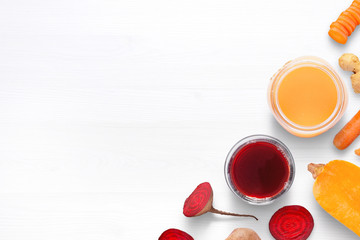 Drained vegetable juice in glass and jar. Copy space beside.