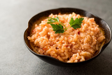 Homemade Tomato Rice with Parsley in Ceramic Bowl / Pilav / Pilaf.