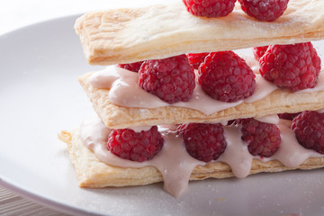 Raspberry mille-feuille dessert on white background