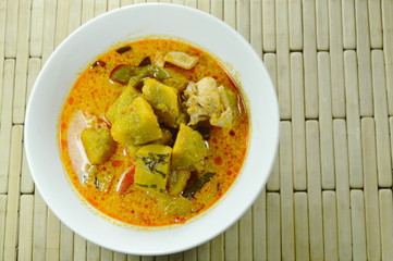 spicy boiled pumpkin with chicken in curry on bowl