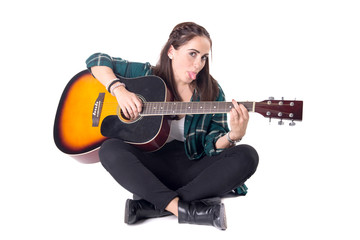 beautiful young girl playing the guitar