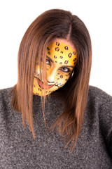 Beautiful young woman with face painted