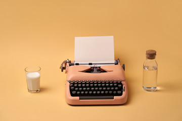 Composition with typewriter, glass and bottle