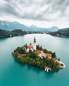 Sunny summer landscape in Julian Alps, Slovenia, Europe. Aerial view of church of Assumption of Maria on the Bled lake. 