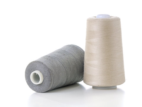 Two cotton thread spools