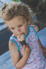 child summer day eating ice cream