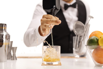 Barman pouring whiskey
