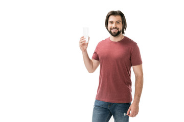 portrait of smiling bearded man with glass of water in hand isolated on white