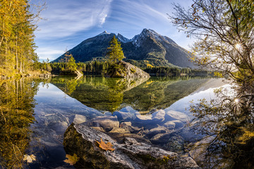 Mountains reflected in crystal clear water of nearby lake. Absolutely stunning landscape scene. Quiet, relaxing, peaceful. Panorama. Travel, destination, holiday, adventure. Austria, Alps.