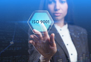 The concept of business, technology, the Internet and the network. A young entrepreneur working on a virtual screen of the future and sees the inscription: ISO 9001
