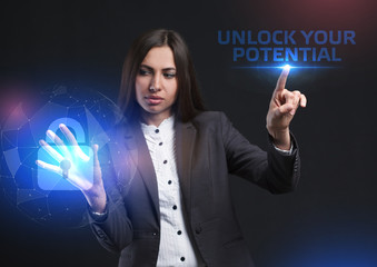 The concept of business, technology, the Internet and the network. A young entrepreneur working on a virtual screen of the future and sees the inscription: Unlock your potential