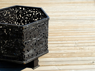 Decorative metal urn in old stiletto. Isolated over white background.