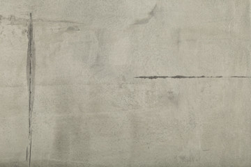Raw or bare concrete wall, shot with panel seam lines perpendicular to image dimension
