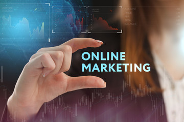 The concept of business, technology, the Internet and the network. A young entrepreneur working on a virtual screen of the future and sees the inscription: Online marketing