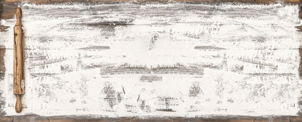 Flour rolling pin wooden table Food background