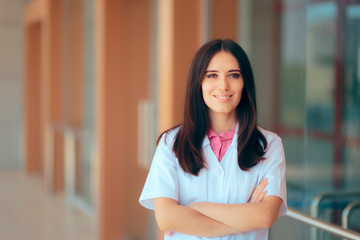 Smiling Female Doctor in Uniform in Front of Hospital Clinic