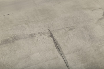 Raw or bare concrete wall, shot with panel seam lines perpendicular to image dimension