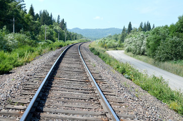 Obraz premium the rotation of the Railways and country roads on the background of wild nature in summer day