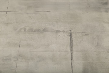 Raw or bare concrete wall, shot with panel seam lines perpendicular to image dimension