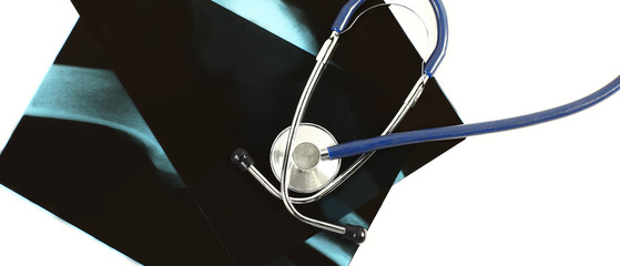 stethoscope and x-rays on a white background
