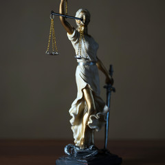 Themis with scales in lawyers office.  Statue of blind goddess 