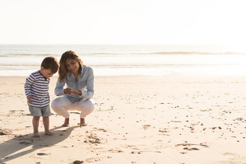 Mother at the beach with toddler