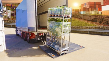  delivery by truck . Loading of the truck . Freight Containers . Truck logistics building . Cargo Transportation - Truck in the warehouse . transportation of freight Europe  . 