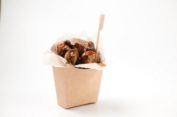 Isolated paper food bag filled with tasty chestnuts