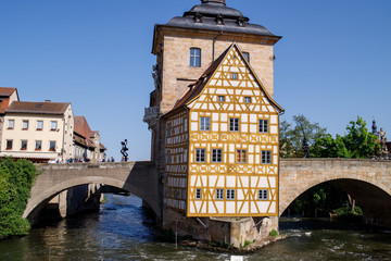 Bamberg. Panoramic view of Old Town Hall of Bamberg (Altes Rathaus) with two bridges over the Regnitz river, Bavaria, Germany