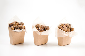 Set of three paper packs filled with tasty chestnuts