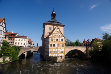Bamberg. Panoramic view of Old Town Hall of Bamberg (Altes Rathaus) with two bridges over the Regnitz river, Bavaria, Germany