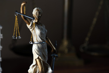 Themis with scales in lawyers office.  Statue of blind goddess 