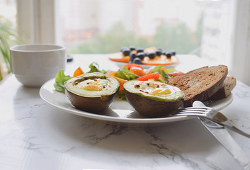 Close up Selective focus of baked avocado with quail eggs Healthy eating concept Breakfast Diet food Low carb