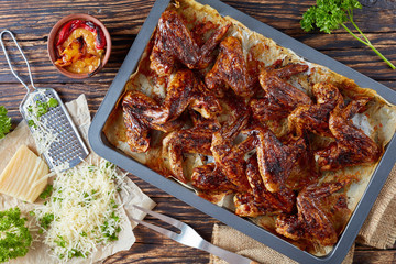 crispy baked parmesan chicken wings, flat lay