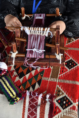 Hands of an arabian weaver