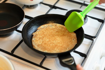Making Pancakes on frying pan. Making Crepes on frying pan.