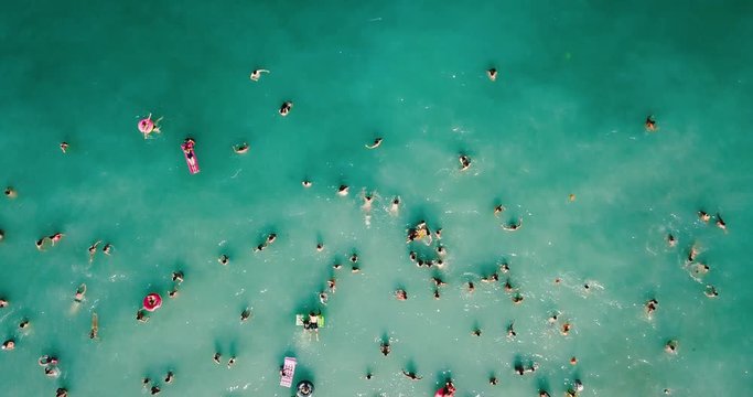 Aerial View From Flying Drone Of People Crowd Having Fun, Playing And Relaxing In Water At The Black Sea In Romania
