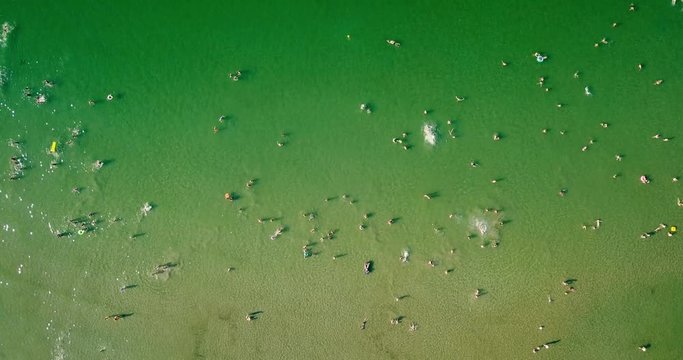 Aerial View From Flying Drone Of People Crowd Having Fun, Playing And Relaxing In Water At The Black Sea In Romania