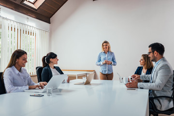 Meeting of executives in a boardroom.