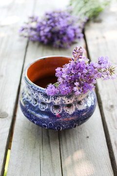 A bouquet of fresh cut lavender with tableware Gzhel