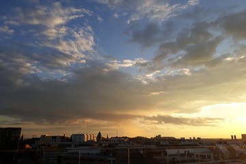 Sunset with clouds of a city