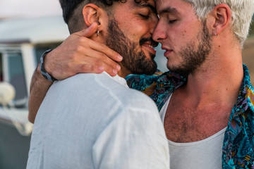 Gay couple kissing in nature