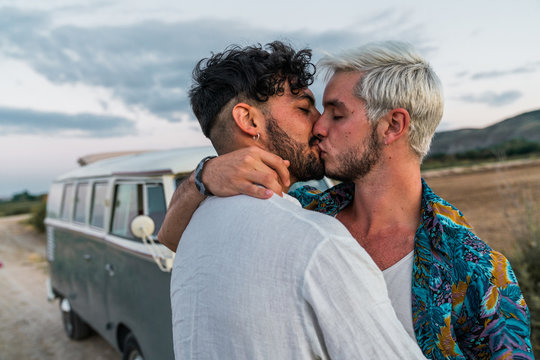 Gay couple kissing in nature