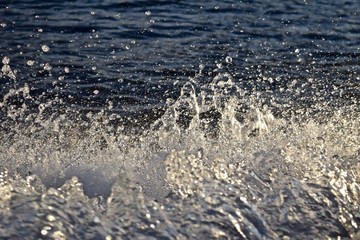 water droplets from boat wake on the lake