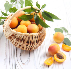 Fresh apricots with green leaves