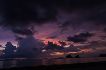 Twilight sky with colorful and cloudy from strom coming over the beach