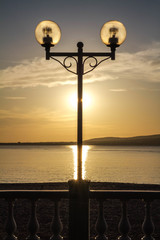 Obraz premium Quay Of Gelendzhik. The setting sun, silhouette, lights, solar path Center. Krasnodar Krai. Russia