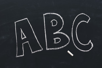 ABC on school blackboard written in chalk