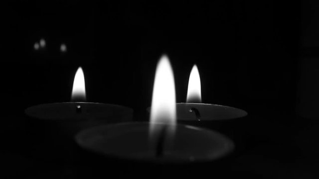 beautiful candle flames. romantic night mood in black and white