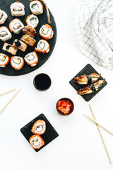 Sushi assortment on white background. Flat lay, top view Japanese cuisine concept.